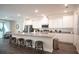 Modern kitchen with stainless steel appliances, an island, and sleek countertops at 351 S Sunset Ave, Mascotte, FL 34753