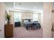 Carpeted main bedroom featuring a bed with nightstands and dressers, offering a tranquil retreat at 351 S Sunset Ave, Mascotte, FL 34753