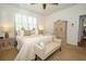 Charming bedroom with neutral tones, plantation shutters, and a decorative armoire at 3574 La Jolla Dr, Clermont, FL 34711