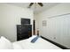 Bedroom with a black dresser, closet, and wardrobe, and black wooden bedframe at 3574 La Jolla Dr, Clermont, FL 34711