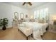 Serene bedroom with neutral decor, plush carpeting, plantation shutters, and a comfortable bed at 3574 La Jolla Dr, Clermont, FL 34711