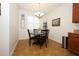 Cozy breakfast nook with a decorative chandelier and window with shutters at 3574 La Jolla Dr, Clermont, FL 34711