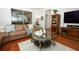 Bright living room showcasing hardwood flooring, comfortable seating, and natural light at 3574 La Jolla Dr, Clermont, FL 34711