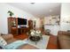 Cozy living room featuring hardwood floors, comfortable seating, and stylish decor at 3574 La Jolla Dr, Clermont, FL 34711