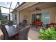 Relaxing screened patio with ample seating, ceiling fan, and a lovely dining area for outdoor enjoyment at 3574 La Jolla Dr, Clermont, FL 34711
