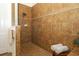 Tiled walk-in shower with glass door and tiled walls at 3574 La Jolla Dr, Clermont, FL 34711