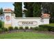 Elegant community entrance sign surrounded by lush landscaping, welcoming you to Colina at 3574 La Jolla Dr, Clermont, FL 34711
