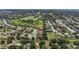 Wide aerial shot shows neighborhood homes, green spaces, golf course, and a sense of community at 3637 Foxchase Dr, Clermont, FL 34711