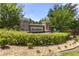 Stone signage at Foxchase community entrance surrounded by manicured shrubbery at 3637 Foxchase Dr, Clermont, FL 34711