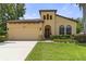 Charming home featuring a well-manicured lawn, two-car garage, and a unique architectural design at 3637 Foxchase Dr, Clermont, FL 34711