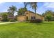 Charming home featuring a well-manicured lawn, two-car garage, and a unique architectural design at 3637 Foxchase Dr, Clermont, FL 34711