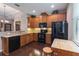 Well-equipped kitchen with granite countertops, wooden cabinets, and black appliances at 3637 Foxchase Dr, Clermont, FL 34711