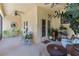 Screened-in lanai with neutral tones, ceiling fans and doors leading to the outdoor living area at 3637 Foxchase Dr, Clermont, FL 34711
