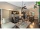 Open-concept living area with hardwood floors, recessed lights and lots of natural light at 3637 Foxchase Dr, Clermont, FL 34711