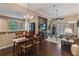 Open-concept living area with hardwood floors, recessed lights and lots of natural light at 3637 Foxchase Dr, Clermont, FL 34711