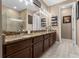 Bathroom with a soaking tub, glass shower enclosure, and double vanity at 366 Reed Grass Dr, Oviedo, FL 32765
