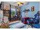 Spacious bedroom with light blue walls, an accent rug, and interesting decor at 366 Reed Grass Dr, Oviedo, FL 32765