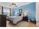 Comfortable bedroom featuring light blue walls, neutral decor, and a ceiling fan at 366 Reed Grass Dr, Oviedo, FL 32765