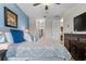 Comfortable bedroom featuring light blue walls, neutral decor, and a ceiling fan at 366 Reed Grass Dr, Oviedo, FL 32765