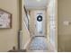 Inviting foyer with a decorative front door, hardwood floors, and staircase at 366 Reed Grass Dr, Oviedo, FL 32765