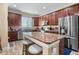 Modern kitchen with stainless steel appliances, granite countertops, and a spacious center island at 366 Reed Grass Dr, Oviedo, FL 32765