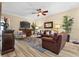 Cozy living room featuring hardwood floors, stylish furniture, and ample natural light at 366 Reed Grass Dr, Oviedo, FL 32765