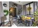 Relaxing screened-in porch with comfortable seating, ceiling fan, and decorated for outdoor living at 366 Reed Grass Dr, Oviedo, FL 32765