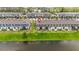 Aerial view of townhomes with pond in the rear at 378 Cape Honeysuckle Pl, Sanford, FL 32771