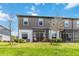 Townhome backyard with a scenic water view and screened patio at 378 Cape Honeysuckle Pl, Sanford, FL 32771