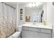 Well-lit bathroom featuring a shower-tub combination and modern vanity at 378 Cape Honeysuckle Pl, Sanford, FL 32771