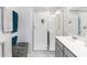 Clean, bright bathroom with a glass shower and ample vanity counter space at 378 Cape Honeysuckle Pl, Sanford, FL 32771