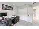 Bright bedroom features a functional desk space, large closet, and neutral color palette at 378 Cape Honeysuckle Pl, Sanford, FL 32771