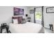 Comfortable bedroom with a plush bed, soft lighting, and scenic view at 378 Cape Honeysuckle Pl, Sanford, FL 32771