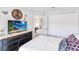 Comfortable bedroom showcases a mounted TV and closet at 378 Cape Honeysuckle Pl, Sanford, FL 32771