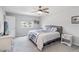 Comfortable bedroom featuring a ceiling fan, natural light, and neutral decor at 378 Cape Honeysuckle Pl, Sanford, FL 32771