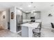 Bright kitchen featuring an island, stainless steel appliances and quartz countertops at 378 Cape Honeysuckle Pl, Sanford, FL 32771
