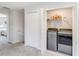 Conveniently located laundry area with modern appliances and shelving at 378 Cape Honeysuckle Pl, Sanford, FL 32771