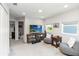 Spacious living room with comfortable seating, a TV, and lots of natural light at 378 Cape Honeysuckle Pl, Sanford, FL 32771
