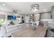 Spacious living area showcasing an open-concept design, kitchen, dining space, and comfortable living room at 378 Cape Honeysuckle Pl, Sanford, FL 32771