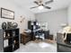 Functional office space with a ceiling fan, computer setup, and ample storage for an efficient work environment at 378 Cape Honeysuckle Pl, Sanford, FL 32771