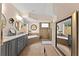 Spacious primary bathroom featuring a soaking tub, walk-in shower, and dual sink vanity at 4048 Gilder Rose Pl, Winter Park, FL 32792