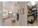 Hallway leading to Primary bathroom with tiled shower, soaking tub, and walk-in closet at 4048 Gilder Rose Pl, Winter Park, FL 32792