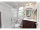 Bathroom features a tiled shower, new fixtures, and cherry wood vanity at 4048 Gilder Rose Pl, Winter Park, FL 32792