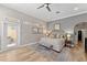 Bedroom features a light gray wall, wood floors and multiple windows for ample light at 4048 Gilder Rose Pl, Winter Park, FL 32792