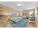 Bright and airy bedroom with vaulted ceiling, fan, and new hardwood floors at 4048 Gilder Rose Pl, Winter Park, FL 32792