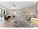 Spacious bedroom with fireplace, TV, sitting area and access to the lanai and pool at 4048 Gilder Rose Pl, Winter Park, FL 32792
