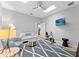 Bonus room features a TV, fan, multiple skylights, comfortable seating, and exercise equipment at 4048 Gilder Rose Pl, Winter Park, FL 32792