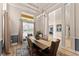 Beautiful dining room featuring a modern chandelier and hardwood floors, creating an inviting space at 4048 Gilder Rose Pl, Winter Park, FL 32792