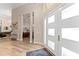 Bright foyer with hardwood floors and a view of the staircase and living spaces at 4048 Gilder Rose Pl, Winter Park, FL 32792