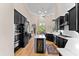 Spacious kitchen boasts black cabinets, stainless steel appliances, an island wine cooler, and ample natural light at 4048 Gilder Rose Pl, Winter Park, FL 32792